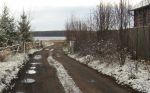 Подъездная дорога к участку. Участок на фото левее от дороги.